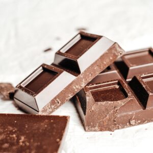 A close-up shot of gourmet dark chocolate bars on a white background. Perfect for food photography enthusiasts.